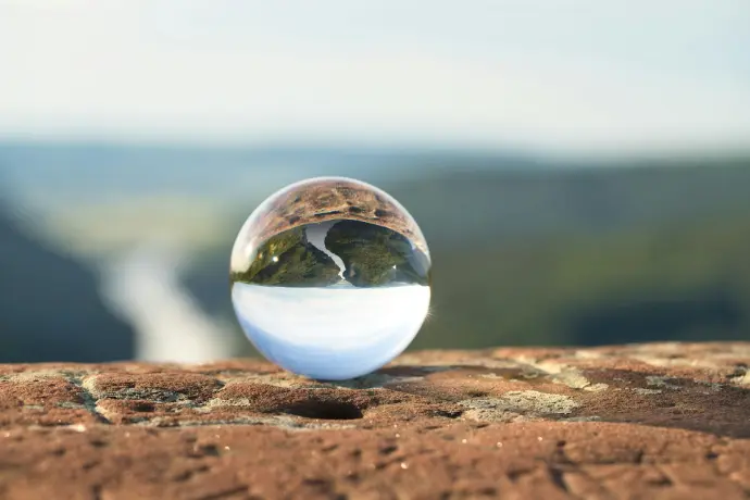 clear marble on brown rock